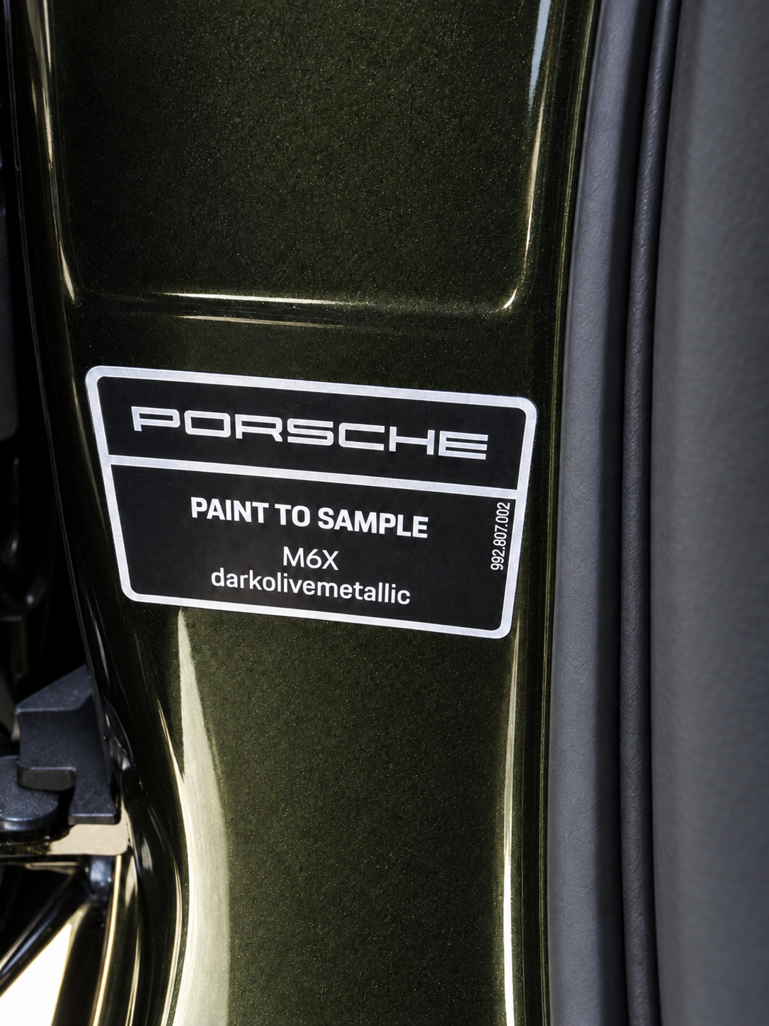 Factory Porsche Paint to Sample label identifying M6X Dark Olive Metallic
