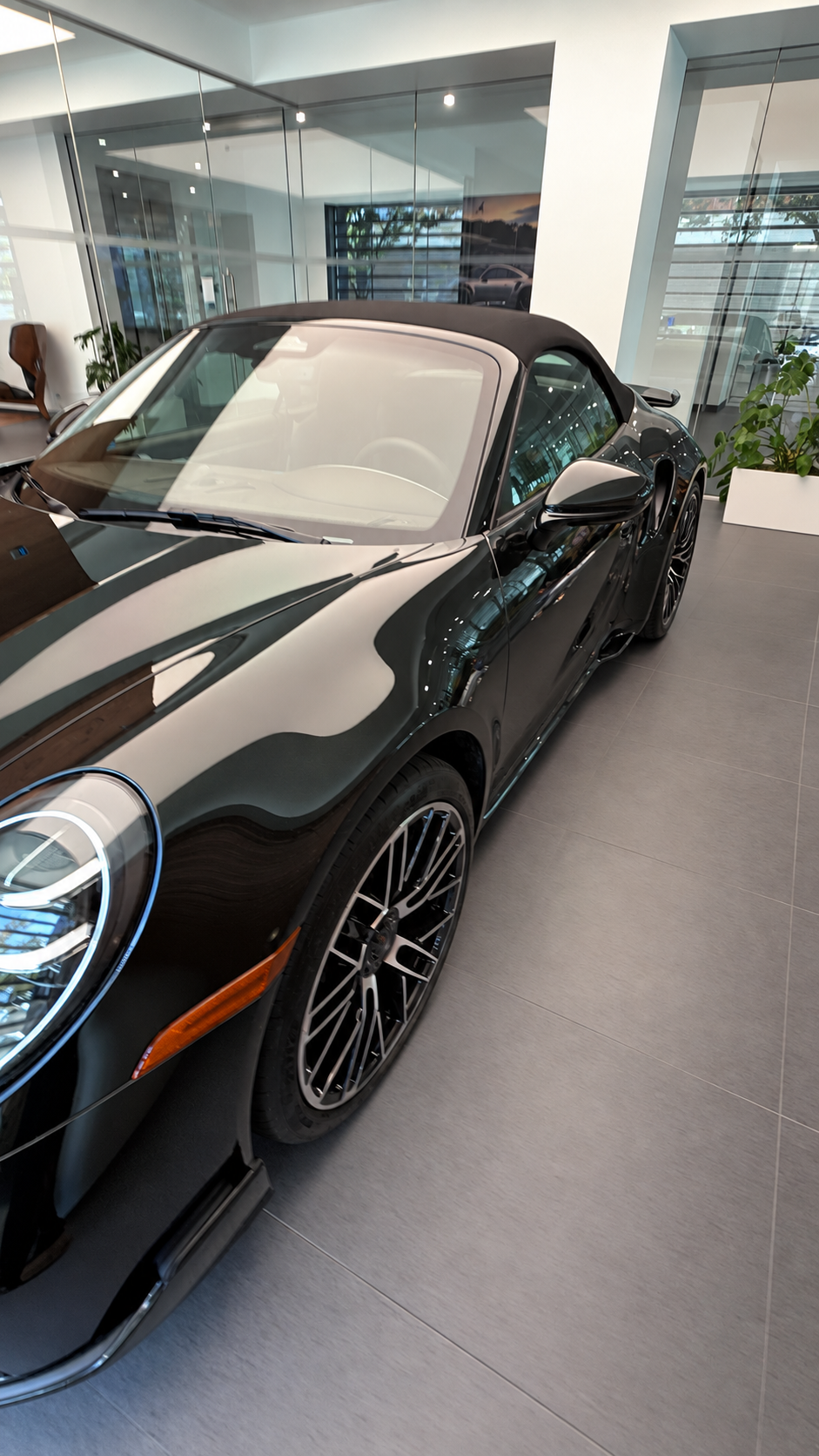 Front driver-side view in the Porsche showroom